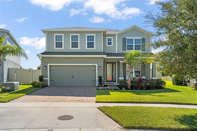 view of front facade featuring a garage and a front lawn