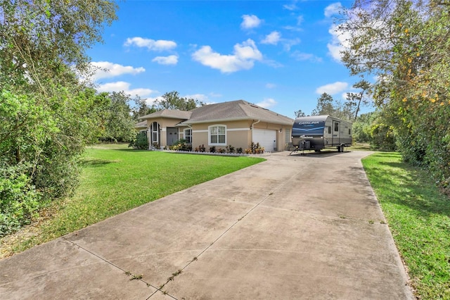 single story home featuring a front yard and a garage