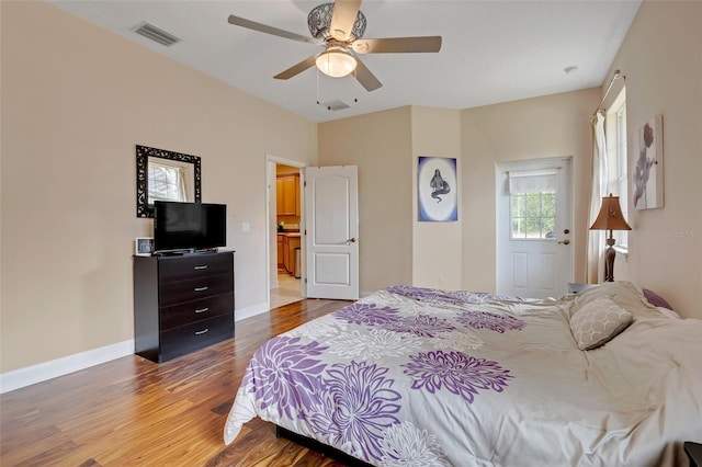 bedroom with wood-type flooring and ceiling fan