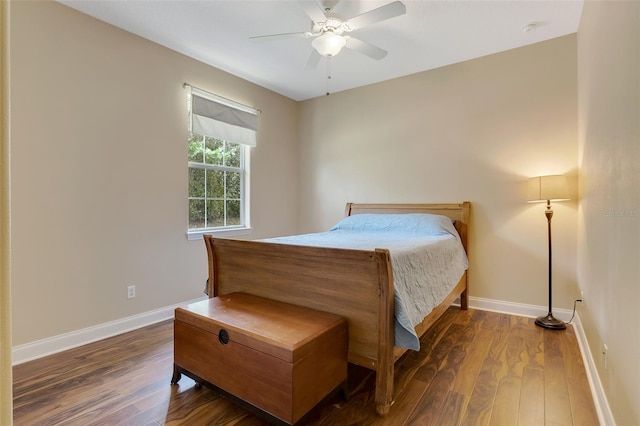 bedroom featuring ceiling fan and dark hardwood / wood-style flooring