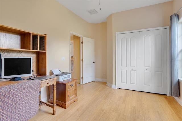 office space featuring ceiling fan and light wood-type flooring