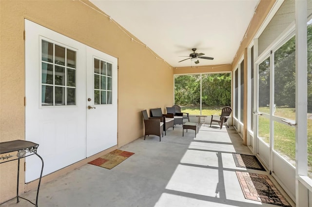 sunroom with ceiling fan and a healthy amount of sunlight