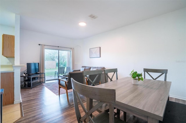 dining room featuring dark hardwood / wood-style flooring