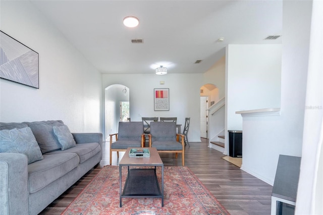 living room with dark wood-type flooring