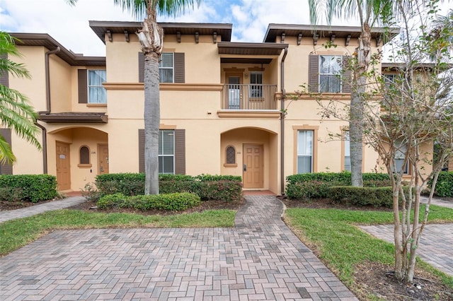 view of front of property with a balcony