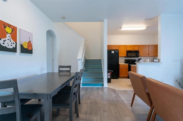 dining room with light hardwood / wood-style flooring