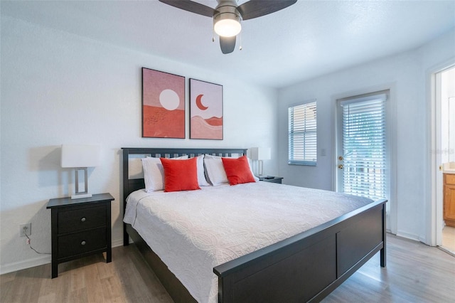 bedroom featuring ceiling fan, ensuite bathroom, and hardwood / wood-style flooring