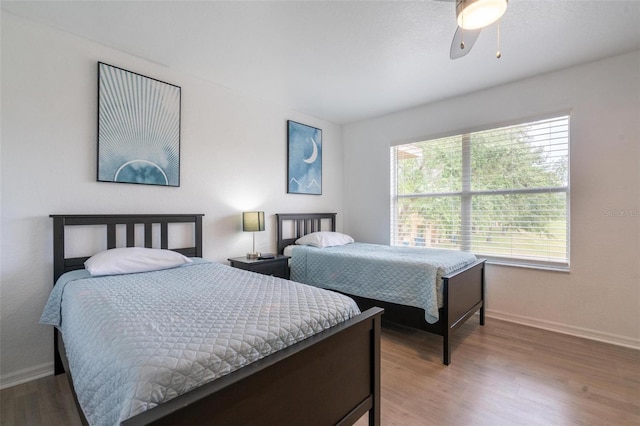 bedroom with hardwood / wood-style flooring and ceiling fan