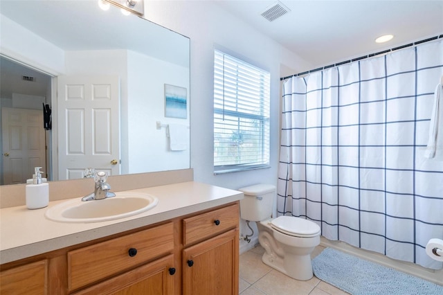 bathroom with toilet, vanity, tile patterned floors, and a shower with shower curtain