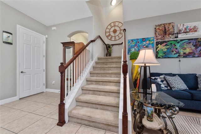 stairs with tile patterned floors