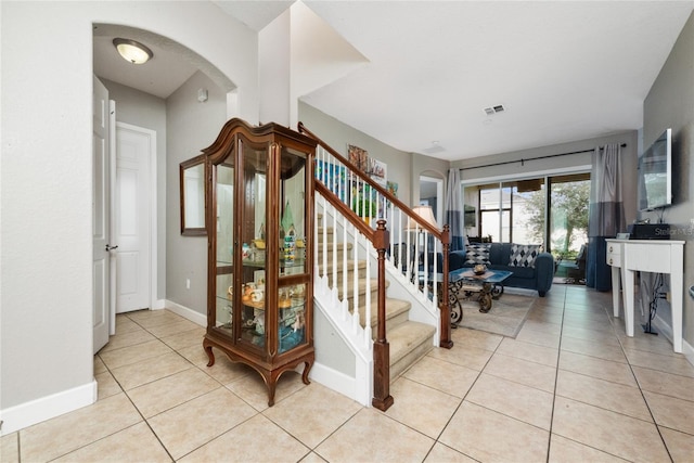 stairway featuring tile patterned floors