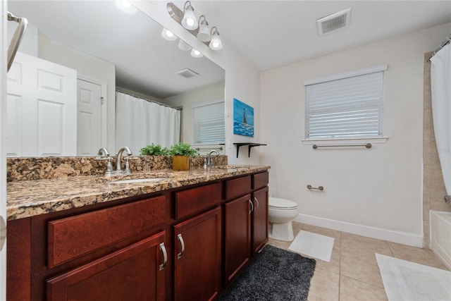 full bathroom featuring vanity, toilet, tile patterned floors, and shower / bath combo with shower curtain