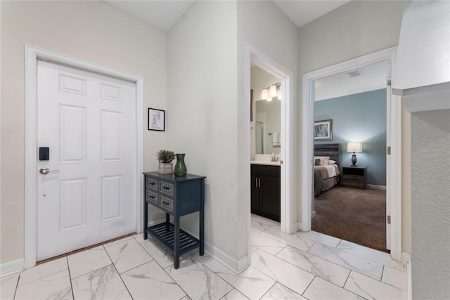 view of carpeted entrance foyer