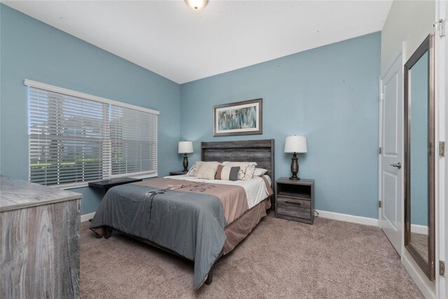 bedroom with light colored carpet