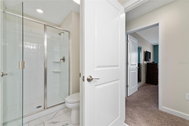 bathroom featuring toilet and walk in shower