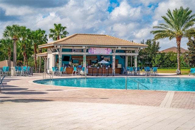 view of swimming pool with a patio