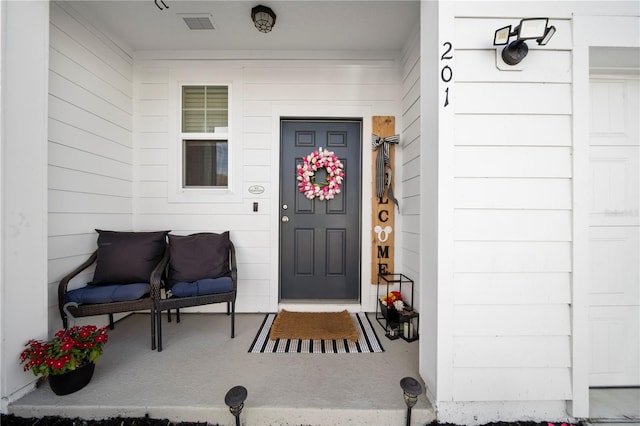 entrance to property featuring a porch