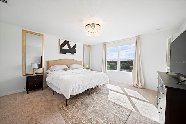 bedroom with light colored carpet