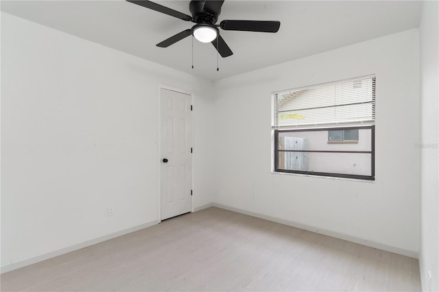 empty room featuring ceiling fan and light hardwood / wood-style floors