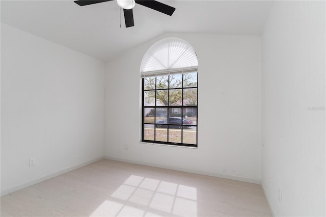 spare room with ceiling fan and vaulted ceiling