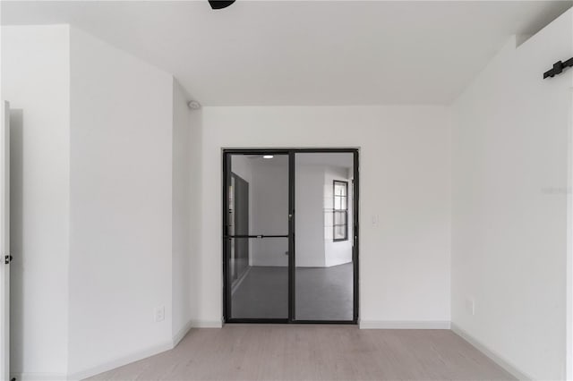 spare room featuring light hardwood / wood-style flooring