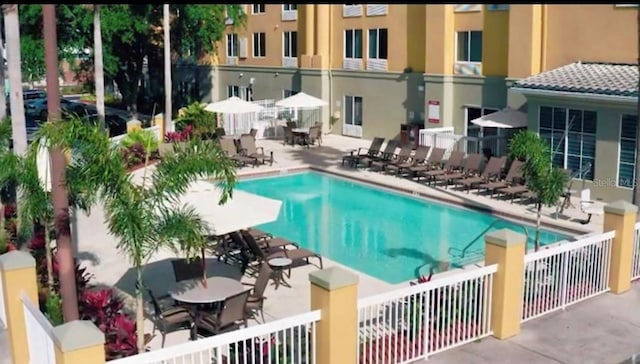 view of pool featuring a patio