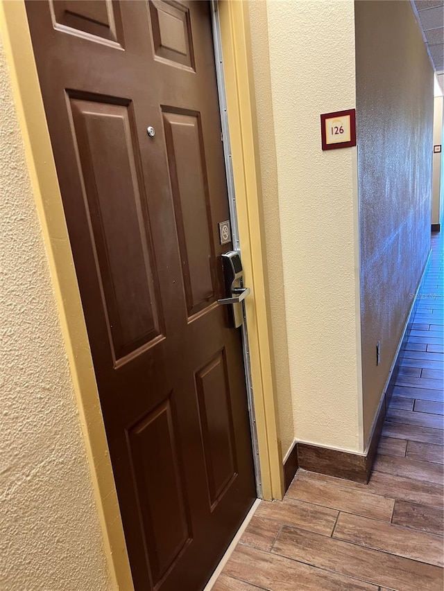 entryway with dark wood-type flooring