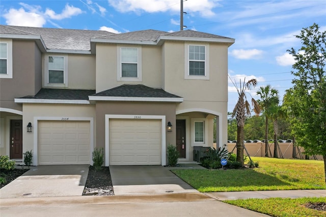 view of front facade featuring a garage and a front lawn