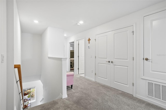 hallway featuring carpet flooring