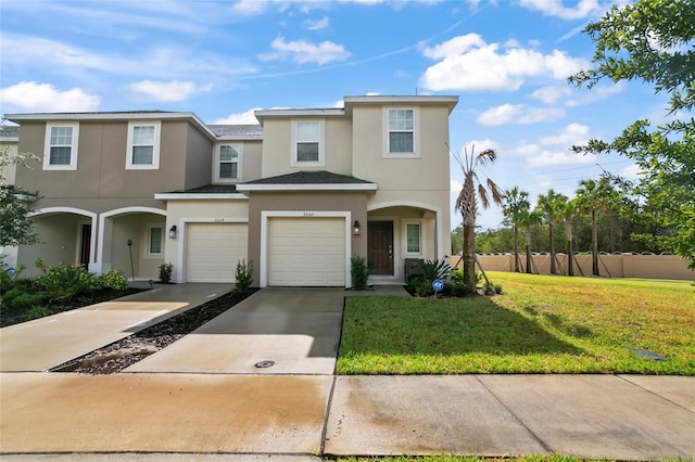 view of front facade featuring a front lawn and a garage