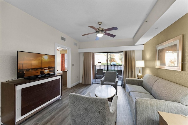 12527 Floridays Resort Dr Unit E-103, Orlando, FL 32821 - living room featuring ceiling fan and wood finished floors