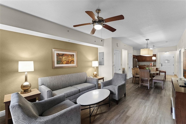 12527 Floridays Resort Dr Unit E-103, Orlando, FL 32821 - living area with wood finished floors, ceiling fan, and electric panel