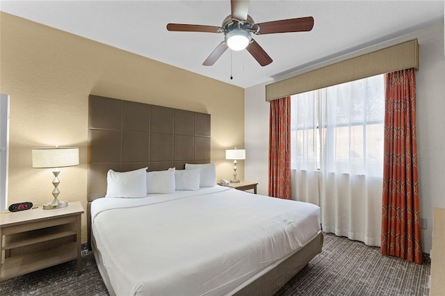 carpeted bedroom featuring ceiling fan