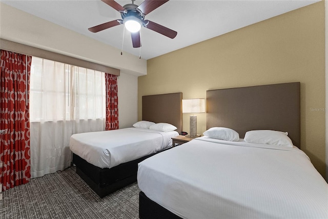 12527 Floridays Resort Dr Unit E-103, Orlando, FL 32821 - carpeted bedroom with a ceiling fan