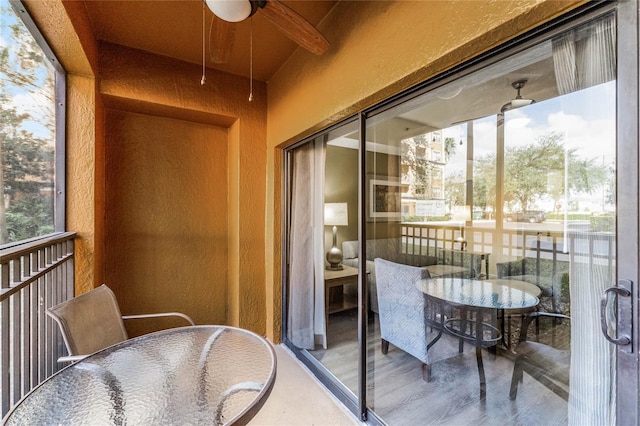 12527 Floridays Resort Dr Unit E-103, Orlando, FL 32821 - balcony featuring a ceiling fan and outdoor dining space