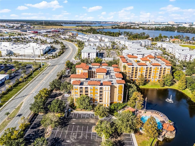 12527 Floridays Resort Dr Unit E-103, Orlando, FL 32821 - drone / aerial view of apartment complex and a nearby body of water