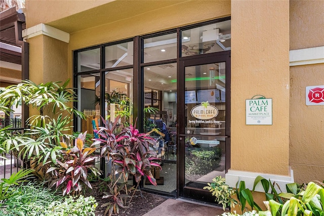 12527 Floridays Resort Dr Unit E-103, Orlando, FL 32821 - doorway to property featuring stucco siding