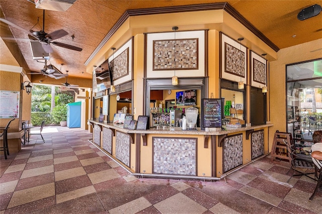 12527 Floridays Resort Dr Unit E-103, Orlando, FL 32821 - reception area with ornamental molding, ceiling fan, and a dry bar