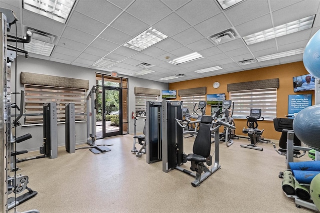 12527 Floridays Resort Dr Unit E-103, Orlando, FL 32821 - gym with baseboards and a paneled ceiling