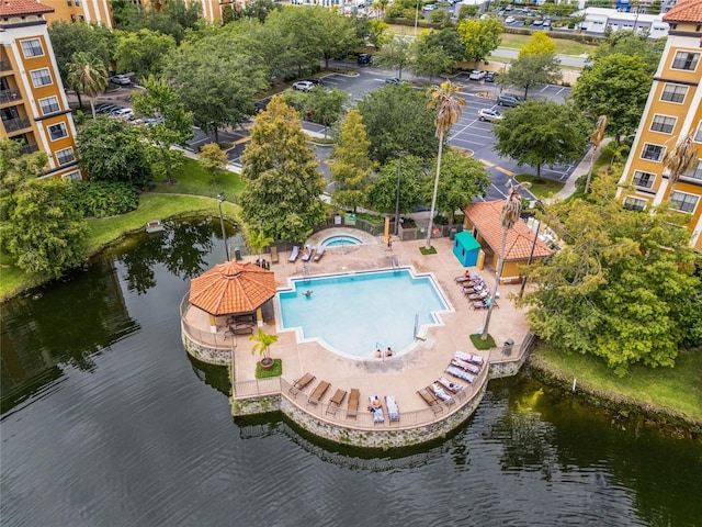 12527 Floridays Resort Dr Unit E-103, Orlando, FL 32821 - drone / aerial view of a pool area and a nearby body of water