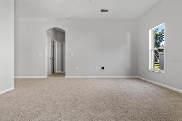 spare room with light carpet