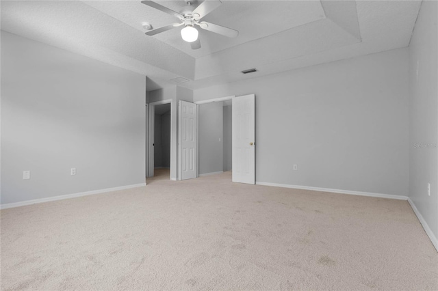 empty room featuring carpet flooring and ceiling fan