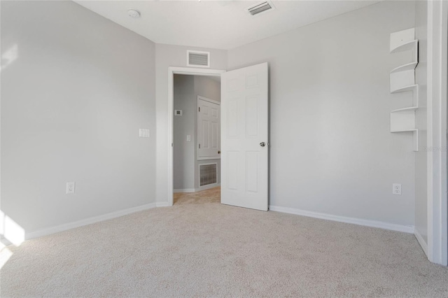 unfurnished bedroom featuring light colored carpet