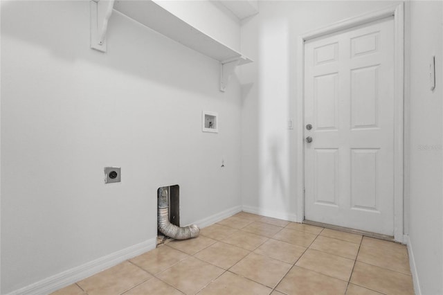 washroom with hookup for an electric dryer, hookup for a washing machine, and light tile patterned floors