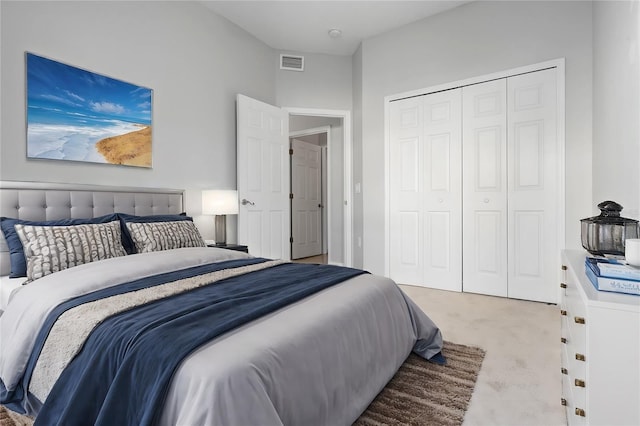 carpeted bedroom with a closet