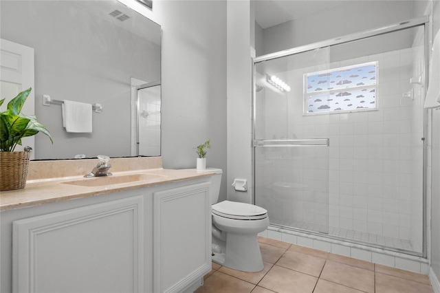 bathroom with toilet, an enclosed shower, and vanity