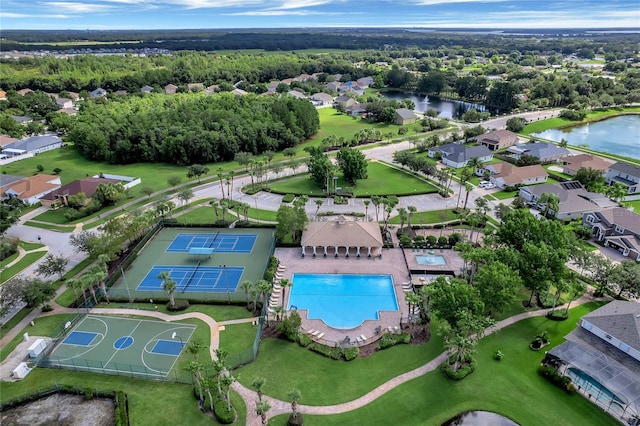 birds eye view of property with a water view