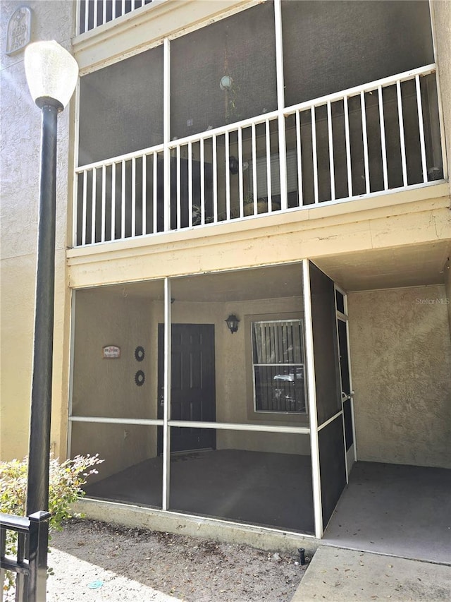 623 Dory Ln Unit 112, Altamonte Springs, FL 32714 - view of exterior entry with stucco siding