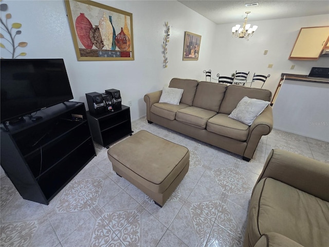 tiled living room with an inviting chandelier