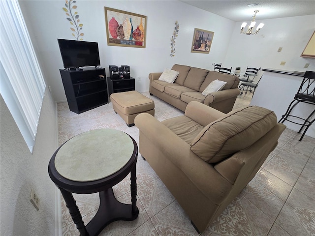 living room featuring an inviting chandelier and light tile patterned floors